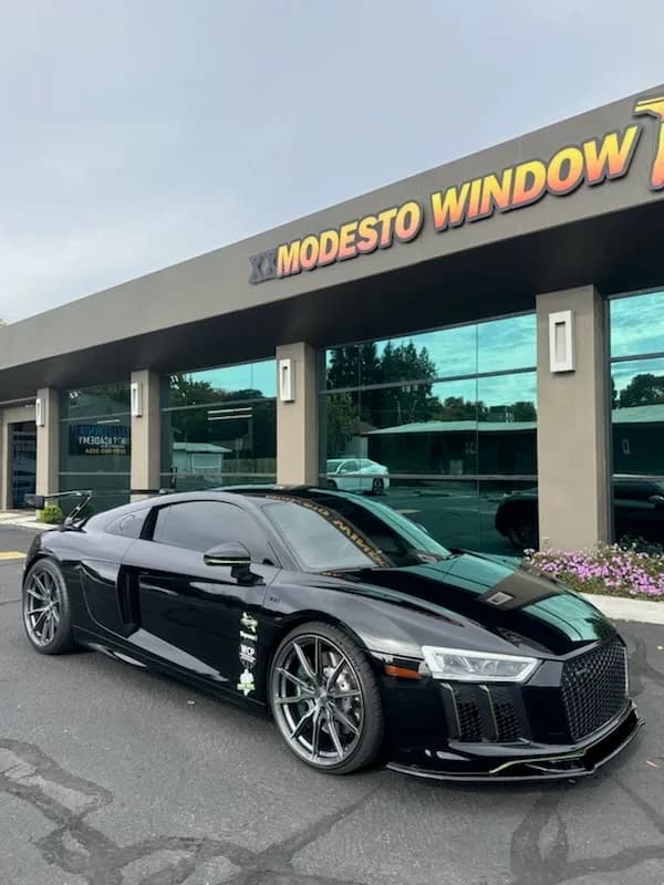 Black Audi R8 supercar with professional window tinting