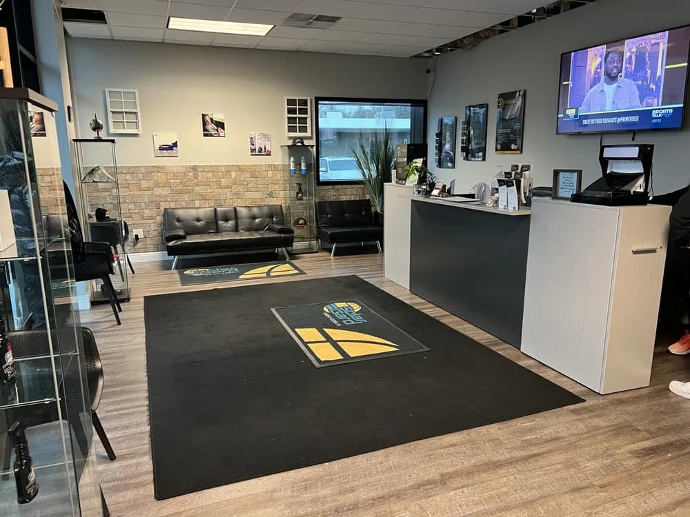 Professional customer waiting area with comfortable seating and entertainment