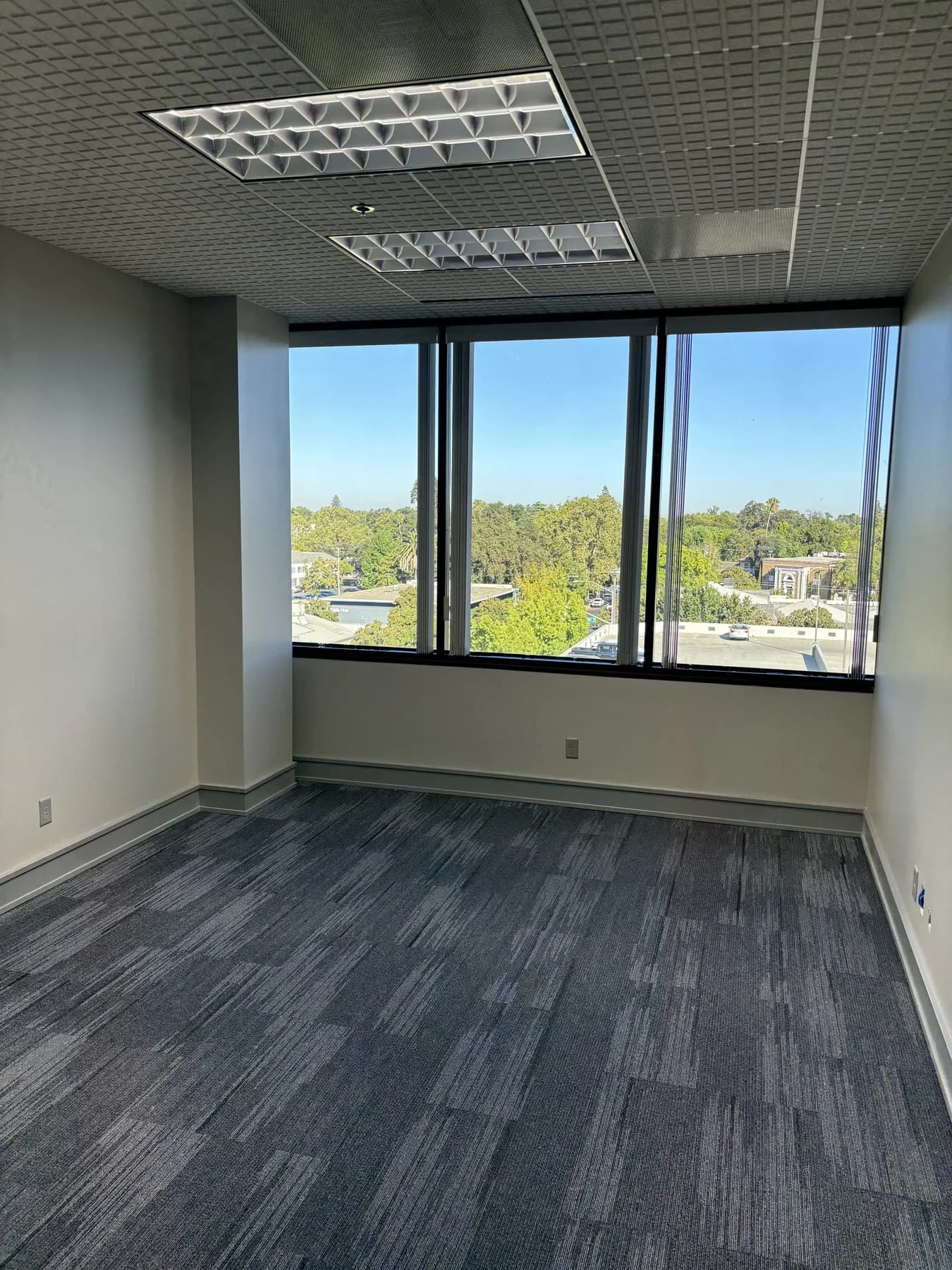 Corner office suite in Modesto with window film keeping natural daylight