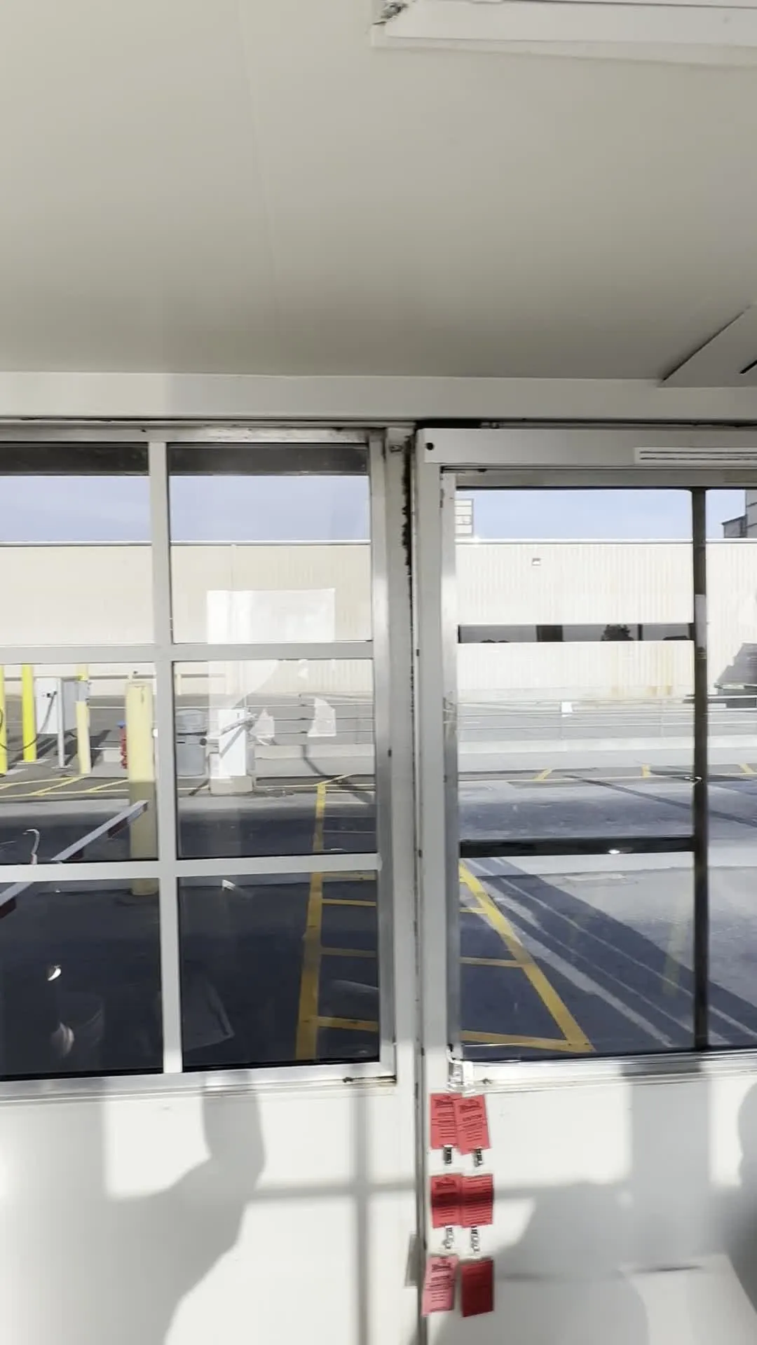 Interior of a security booth with monitors protected by privacy window film