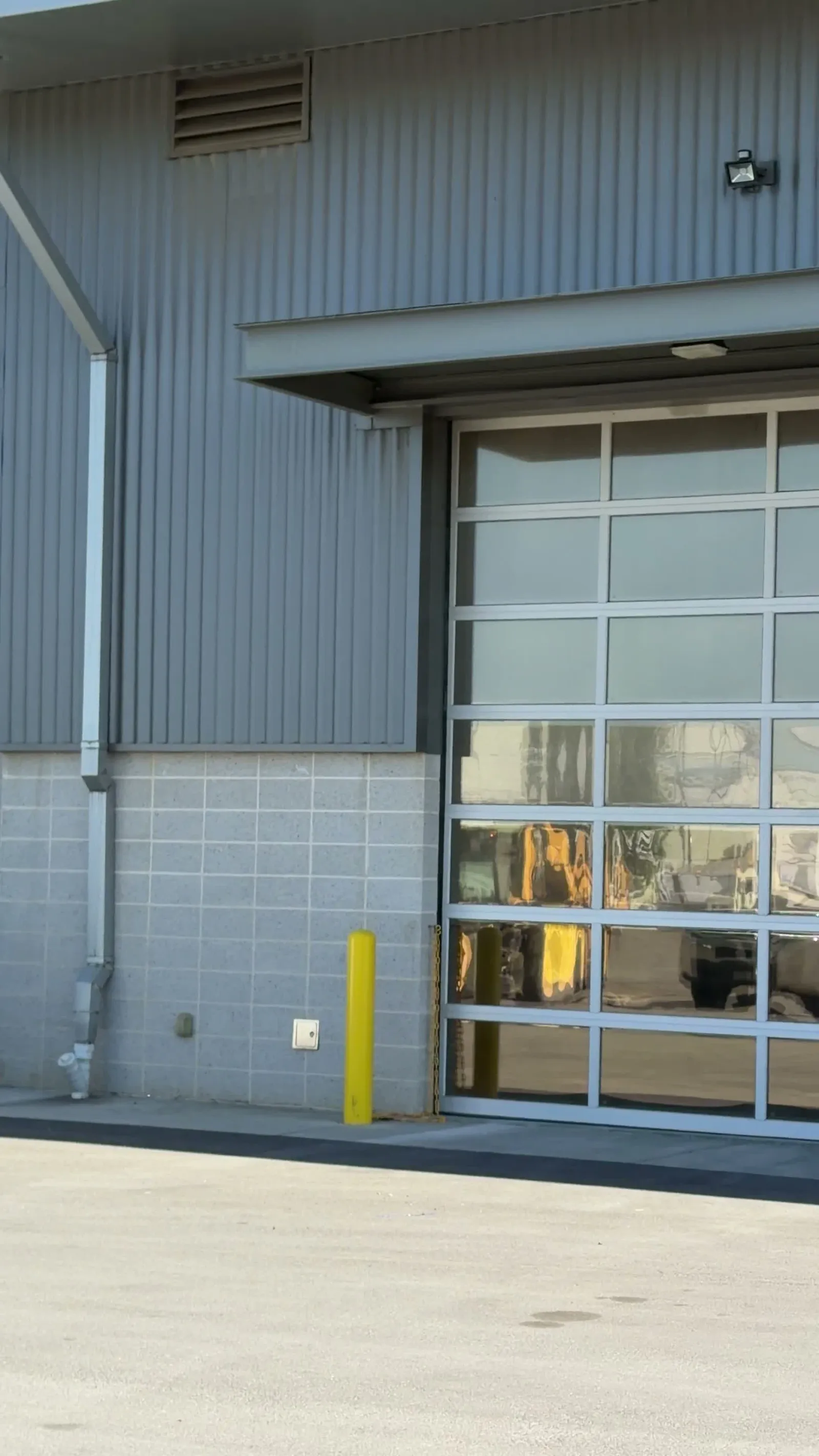 Video walking the Stanislaus County Public Works bay elevation in Modesto past the filmed glass bay doors