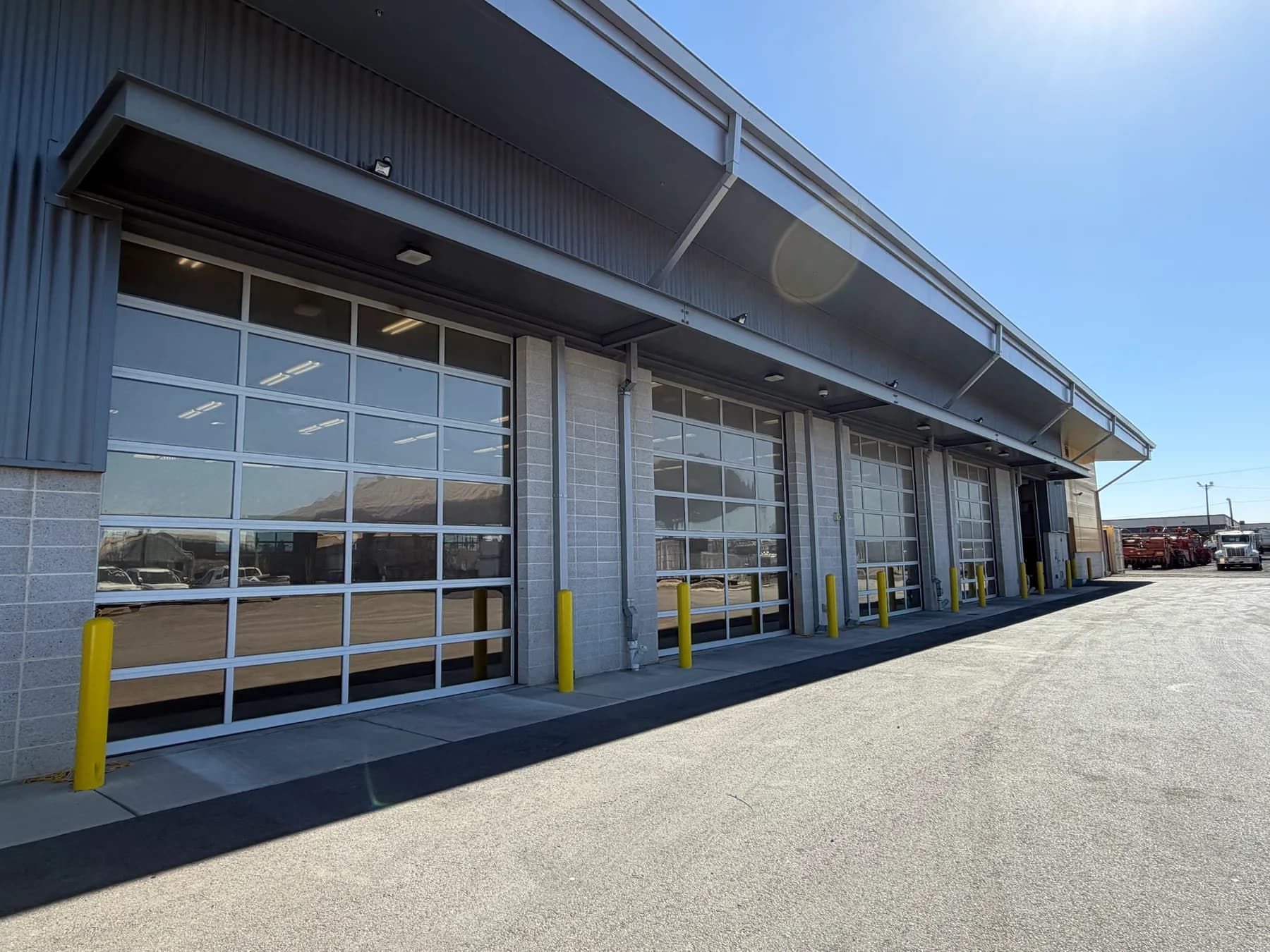 Stanislaus County Public Works building in Modesto with Solar Gard TrueVue 30 window film on its full-view glass bay doors