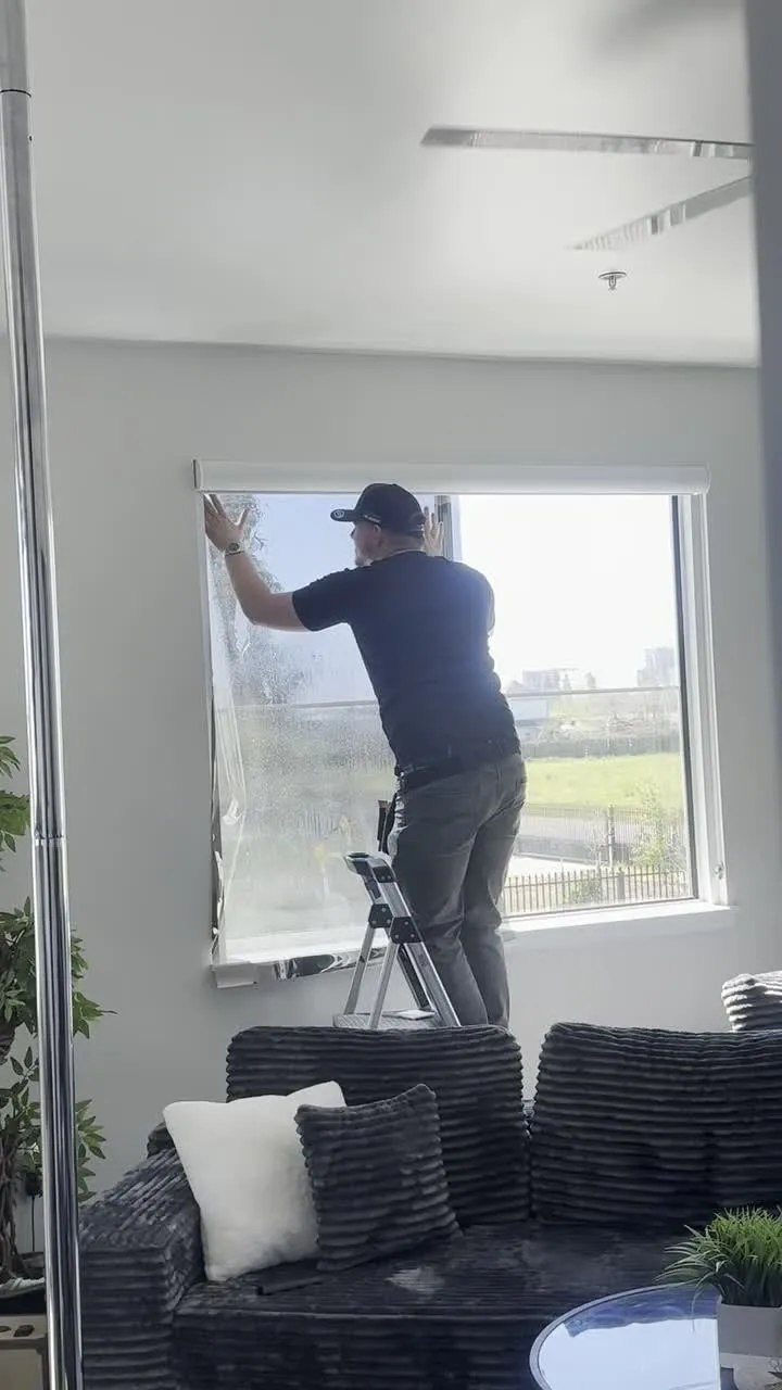 Window film installation in progress at a Turlock commercial office